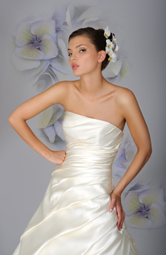 Fuller A-line a symmetric gown, folding of fabric follows through to hem line simple in design with a fantastic look